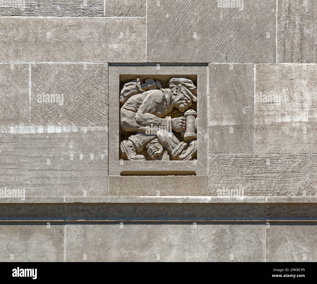 Williamsburgh Savings Bank’s limestone base is richly carved with savings and banking symbols