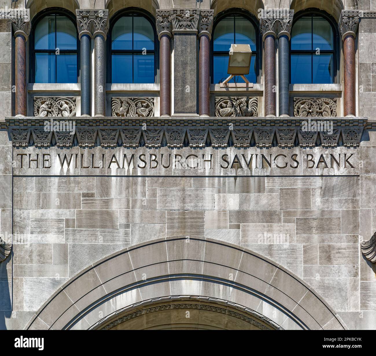 Williamsburgh Savings Bank’s limestone base is richly carved with