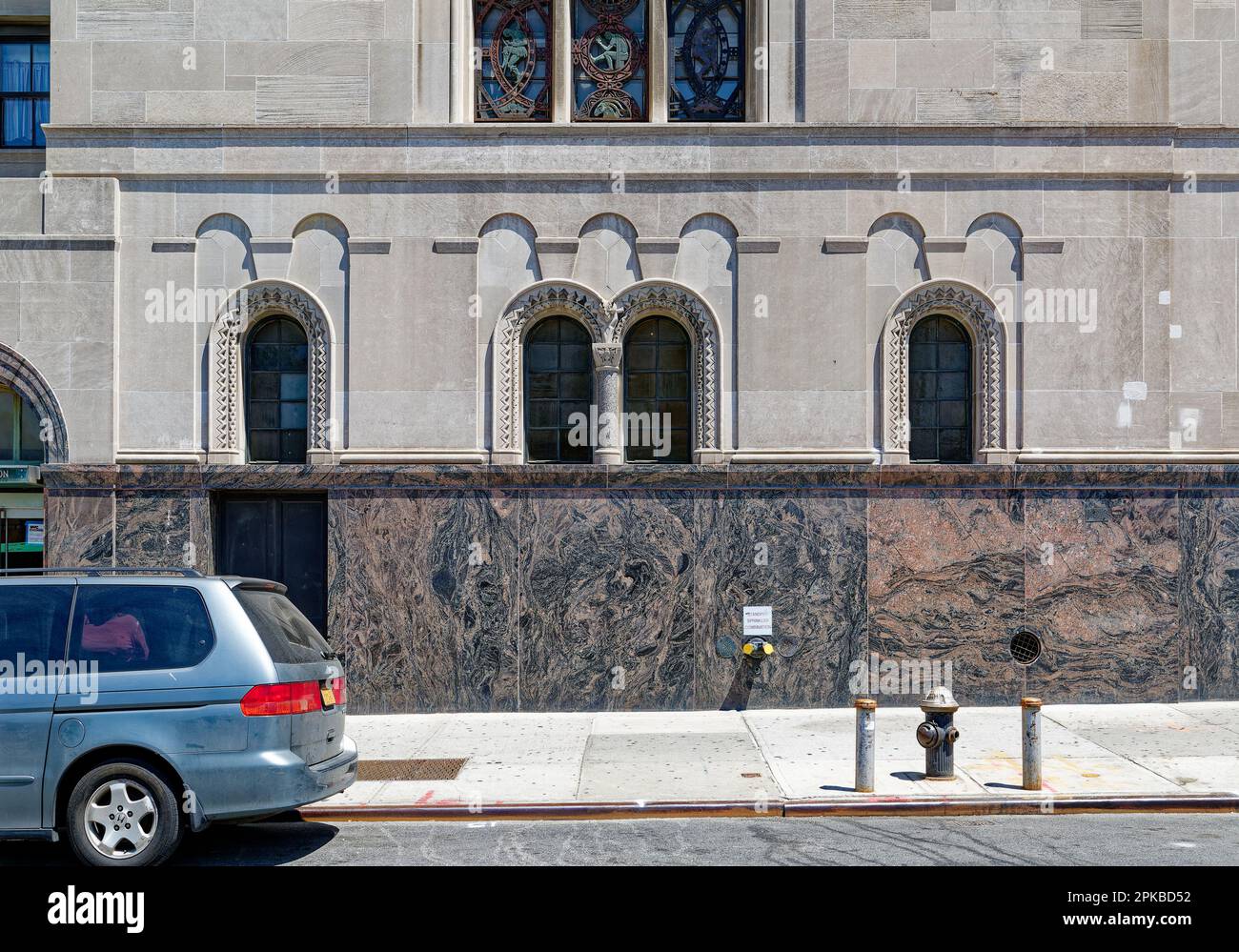 Williamsburgh Savings Bank’s limestone base is richly carved with savings and banking symbols