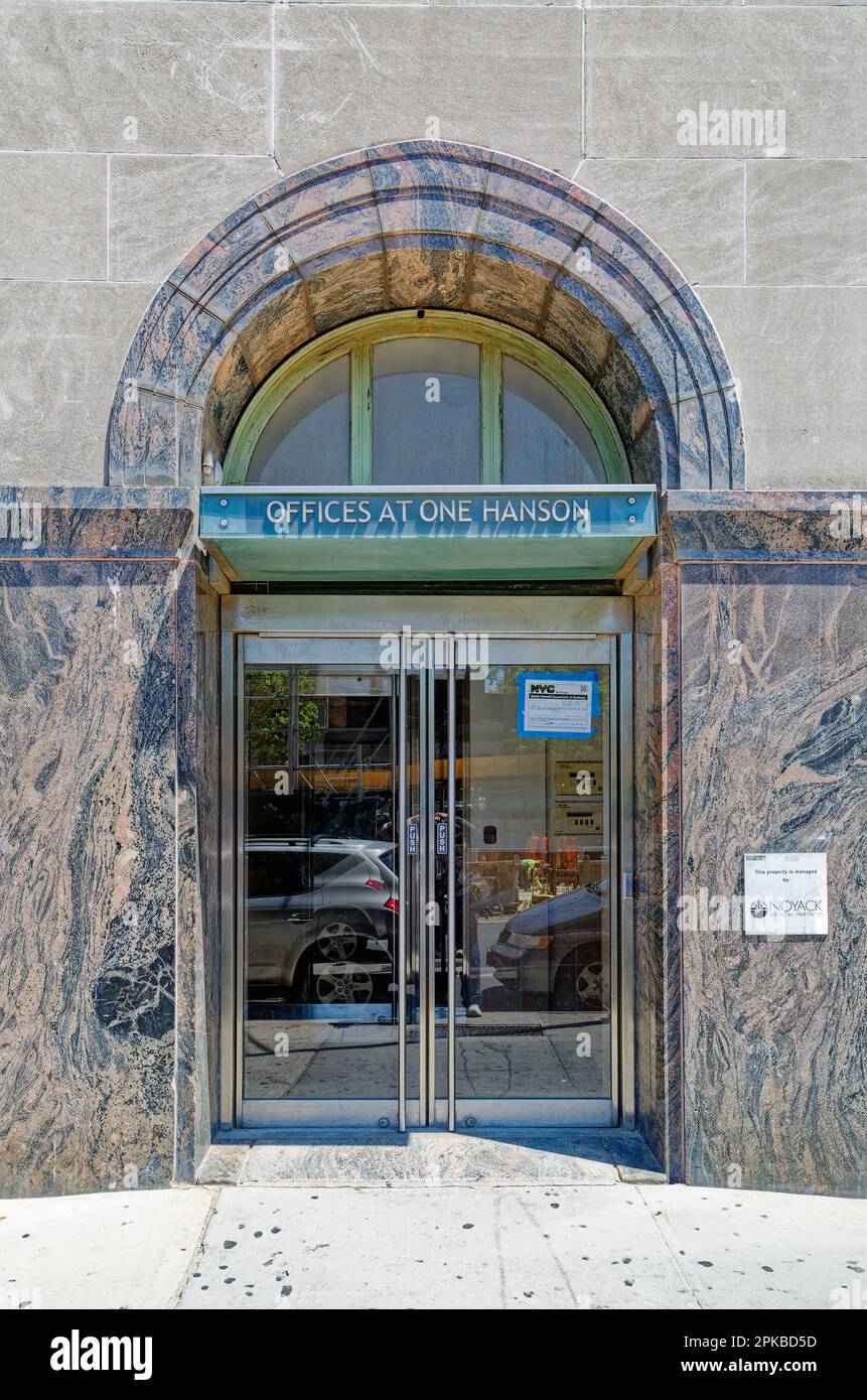 Williamsburgh Savings Bank’s limestone base is richly carved with savings and banking symbols