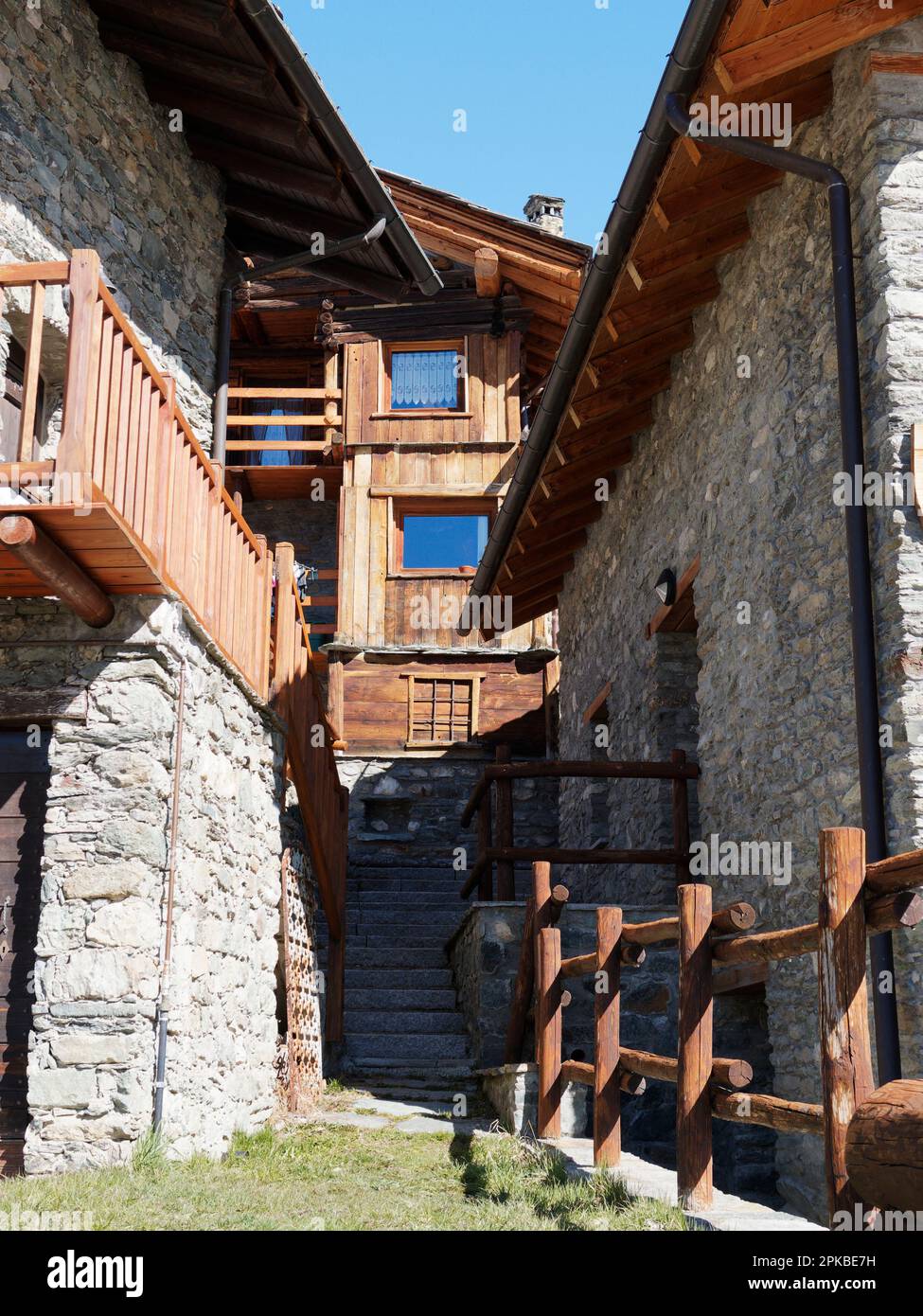 Wooden and stone built houses in the village of Chamois in the Aosta Valley Italy Stock Photo