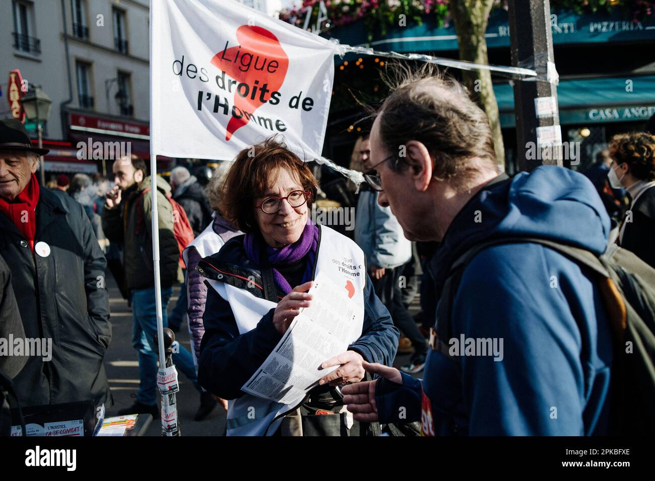 Paris, France. 6th Apr 2023. Jan Schmidt-Whitley/Le Pictorium -  Demonstration against pension reform in Paris   -  6/4/2023  -  France / Paris / Paris  -  Activists from the League for the Defence of Human Rights talk to demonstrators. For the 11th day, demonstrators marched in France. Between 600,000 people, according to the government, and 2 million, according to the unions. The processions were more modest than in previous mobilisations. In Paris, the demonstrators remained mobilised and enthusiastic. Credit: LE PICTORIUM/Alamy Live News Stock Photo