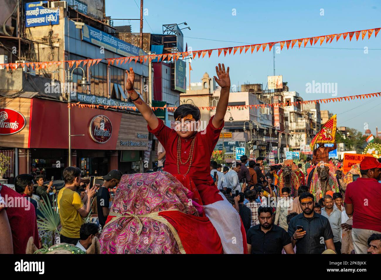 A Hindu devotee chants hanuman during a procession for the Hindu festival Hanuman Jayanti. The festival commemorates the birth of the Hindu deity Hanuman. Stock Photo