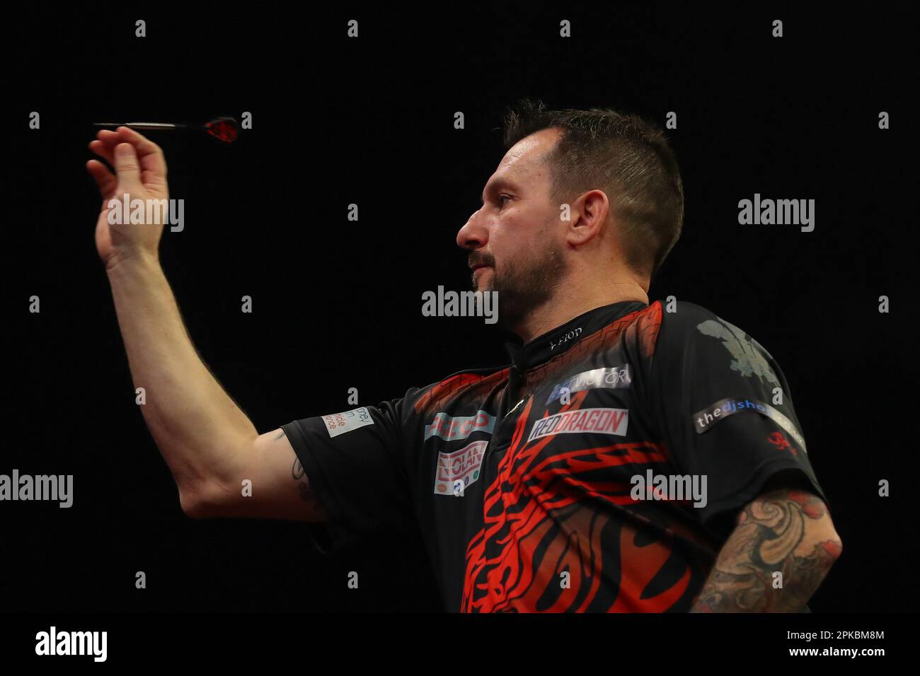Jonny Clayton throws a dart during the 2025 Cazoo PDC Premier League
