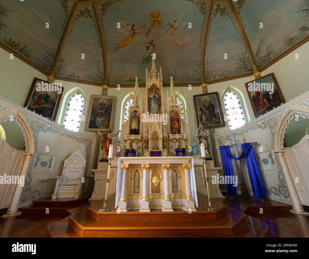 The sanctuary, altar, reredos, and religious statues in St. Mary