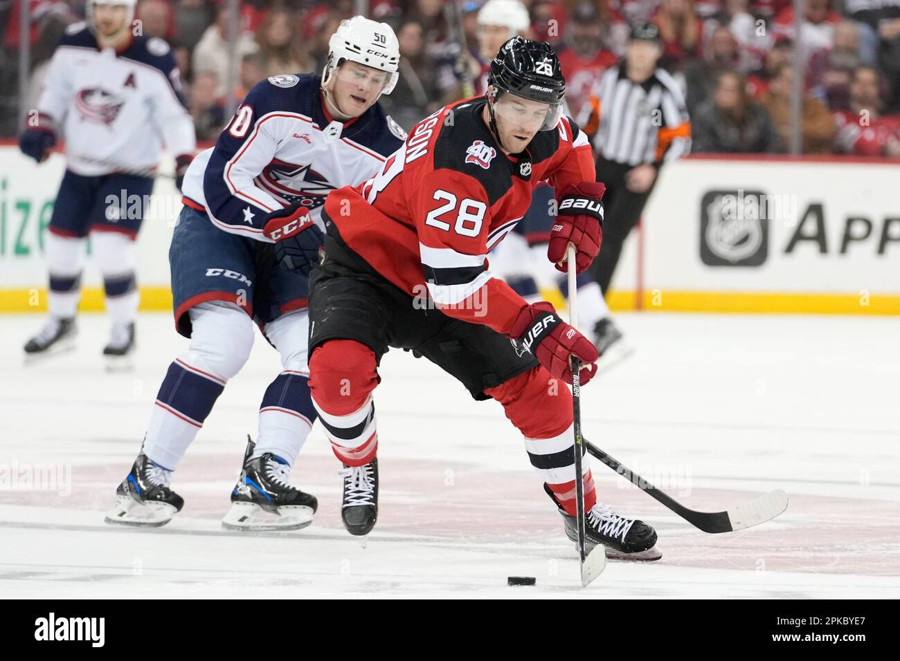 New Jersey Devils defenseman Damon Severson (28) skates with the puck ...