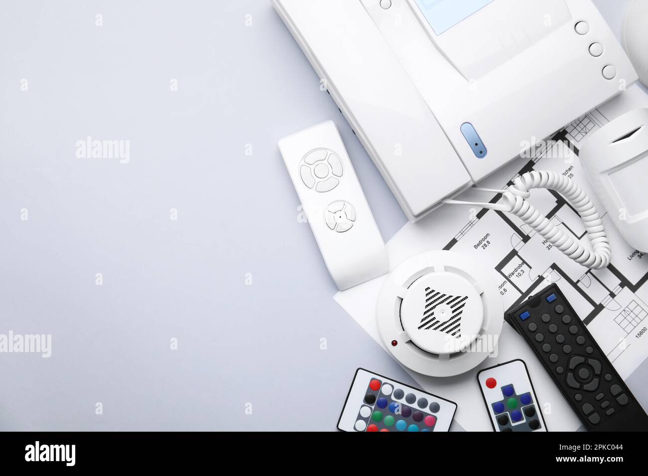 Remote controls, building plan, smoke and movement detectors