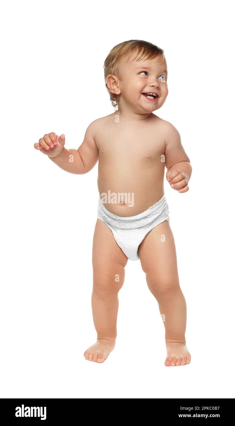 Cute baby in diaper learning to walk on white background Stock Photo