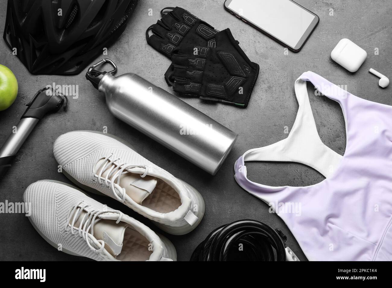 Flat lay composition with different cycling accessories on grey background Stock Photo