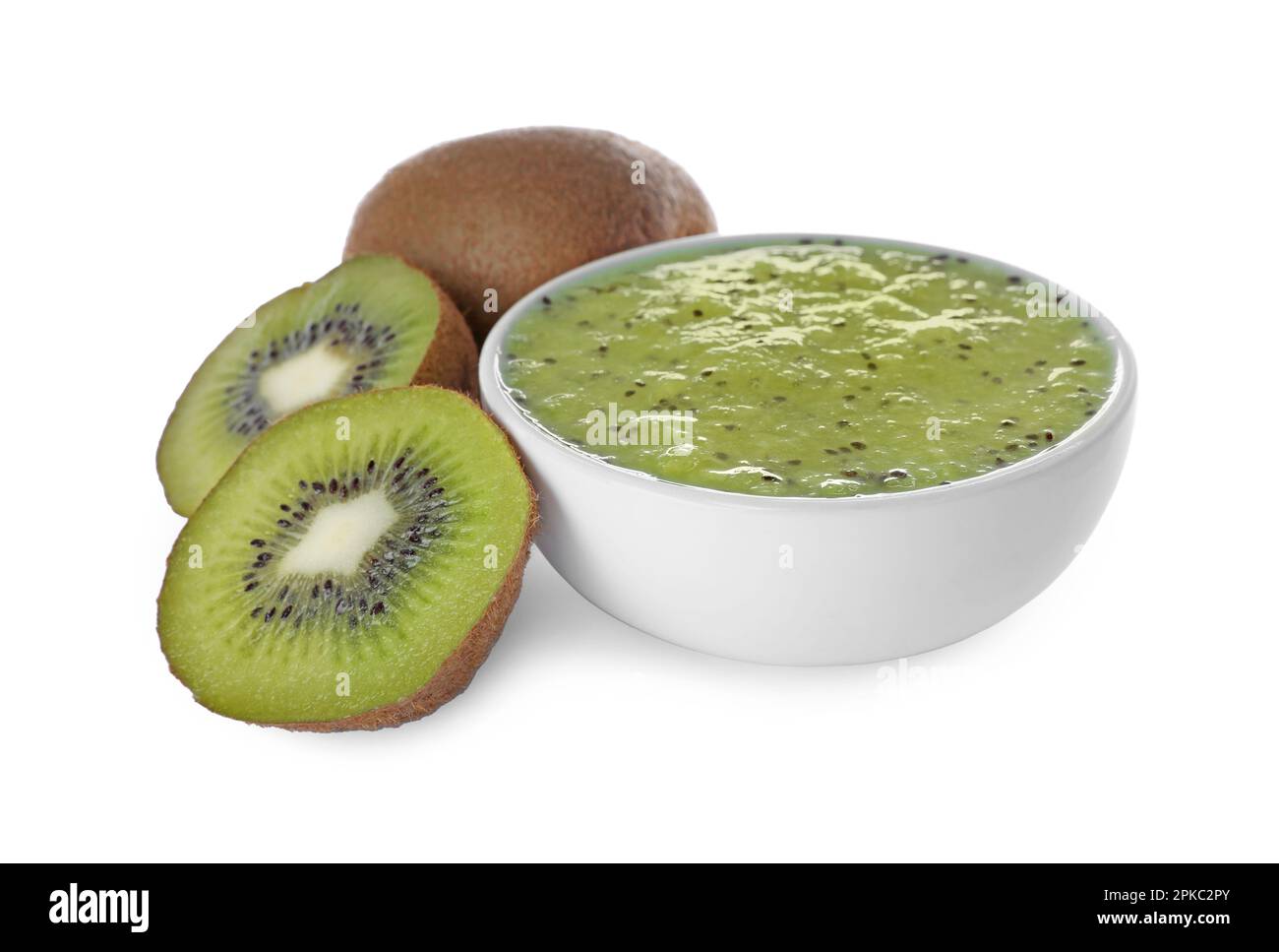Kiwi puree in bowl and fresh fruits on white background Stock Photo - Alamy