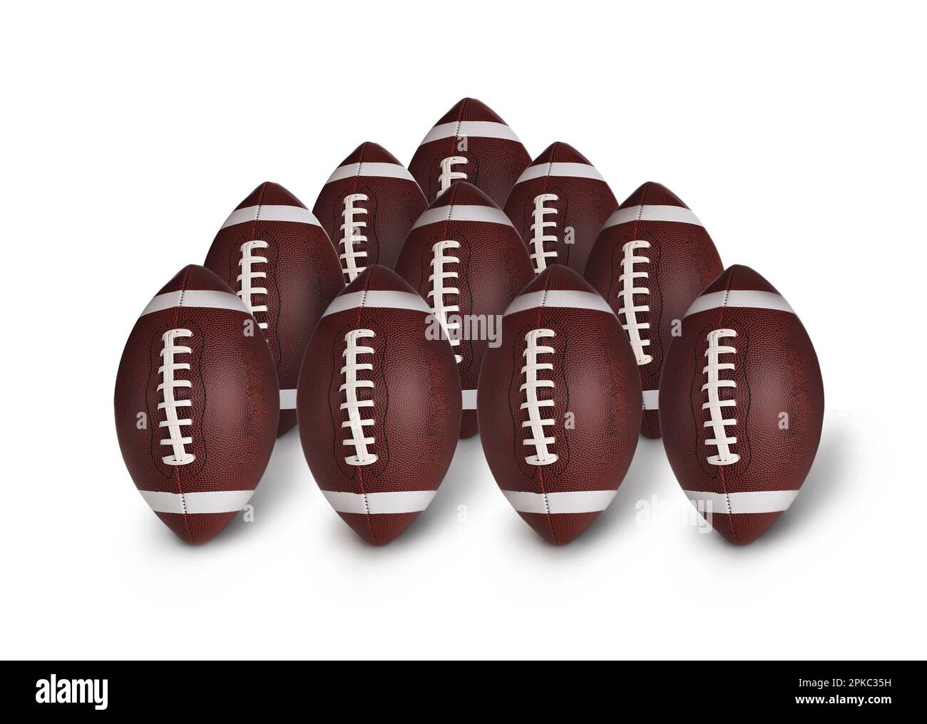 Many leather American football balls on white background Stock Photo