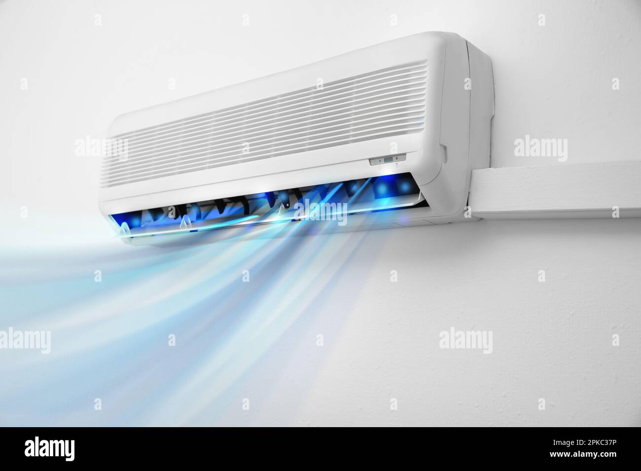 Modern conditioner and illustration of cool air flow on white wall ...
