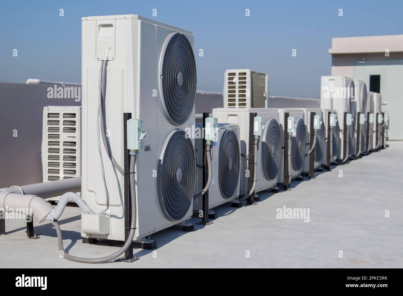 Air conditioning (HVAC) on the roof of an industrial building with blue