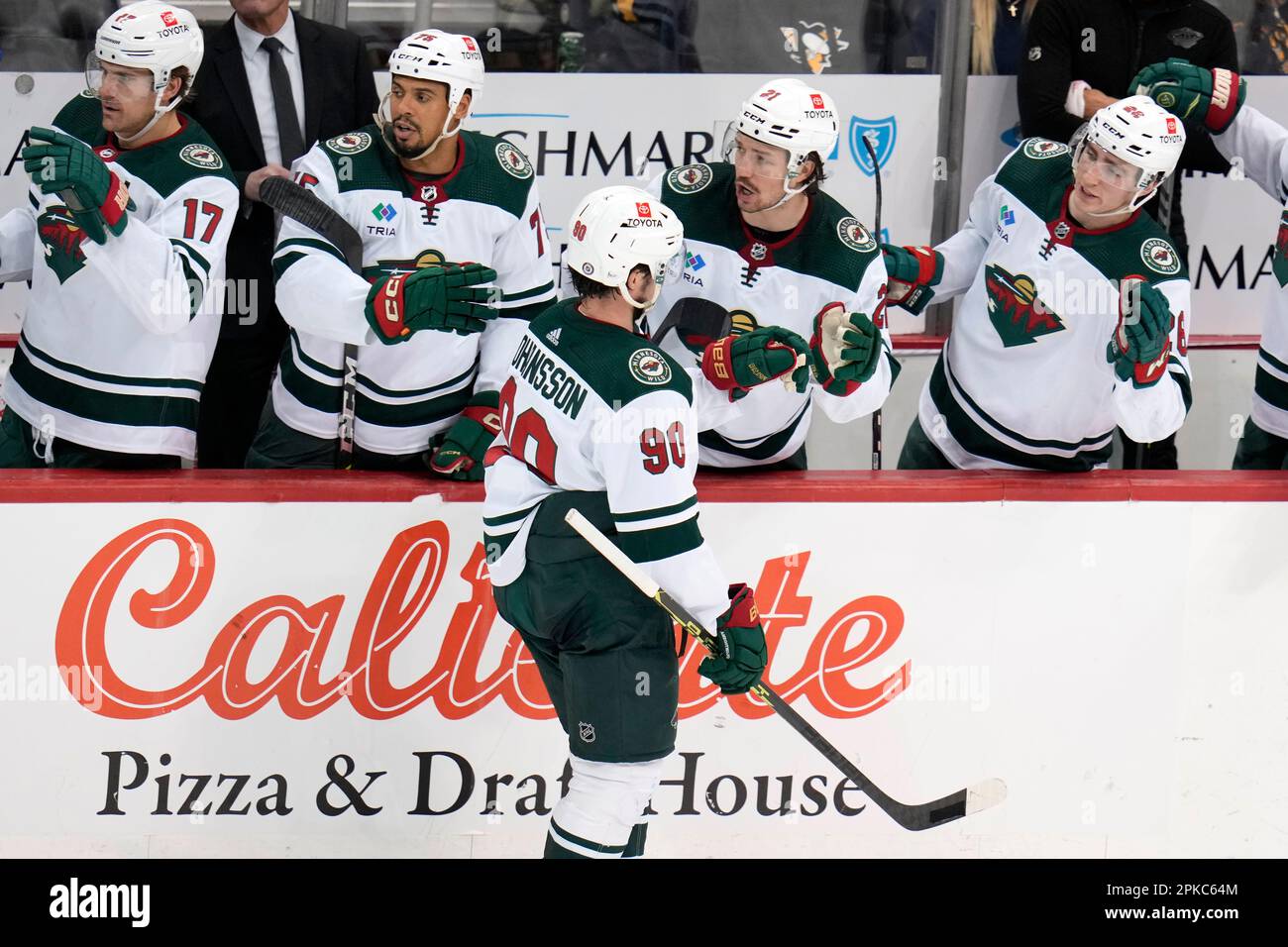 Minnesota Wild's Marcus Johansson (90) returns to the bench after scoring during the third