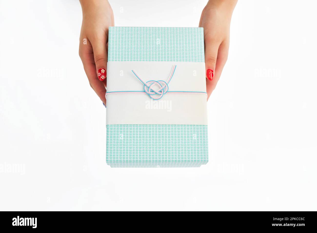 Woman holding gift box with mizuhiki decoration Stock Photo