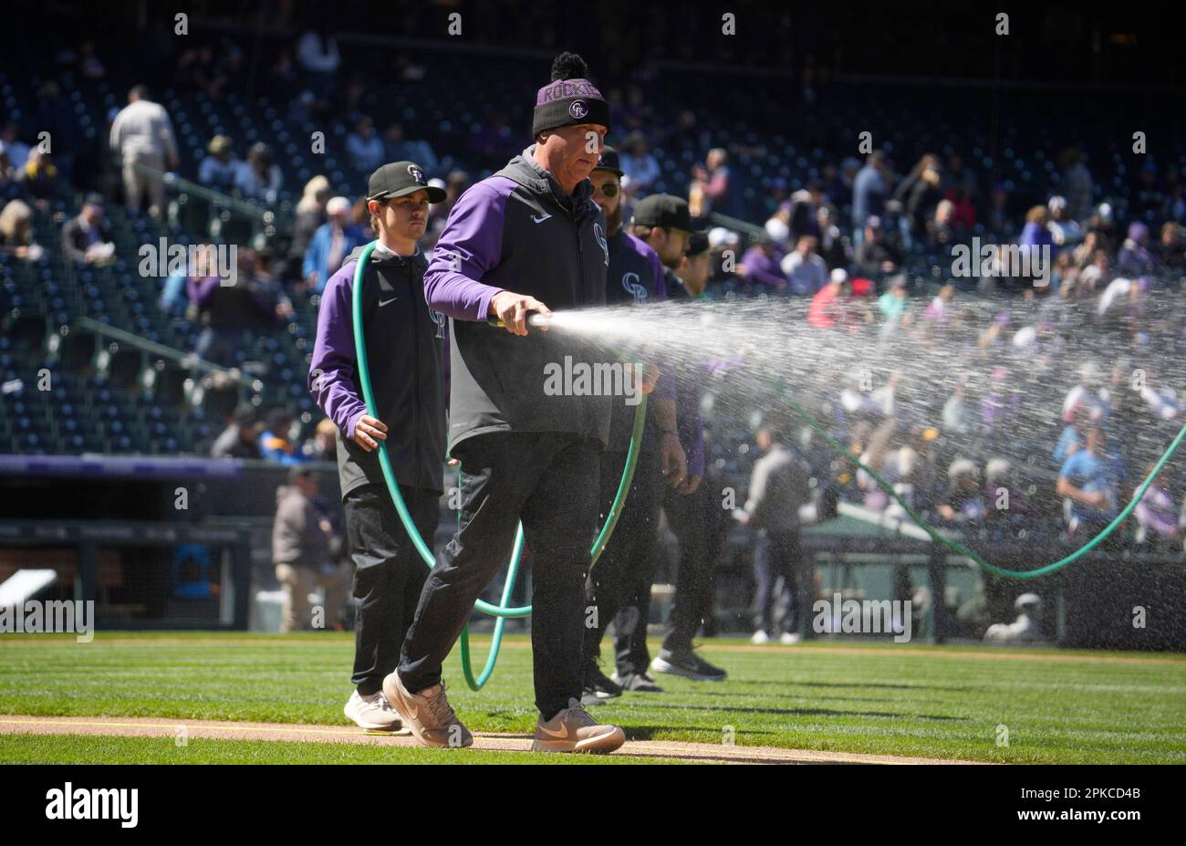 Head groundskeeper Mark Razum prepares the field before the first