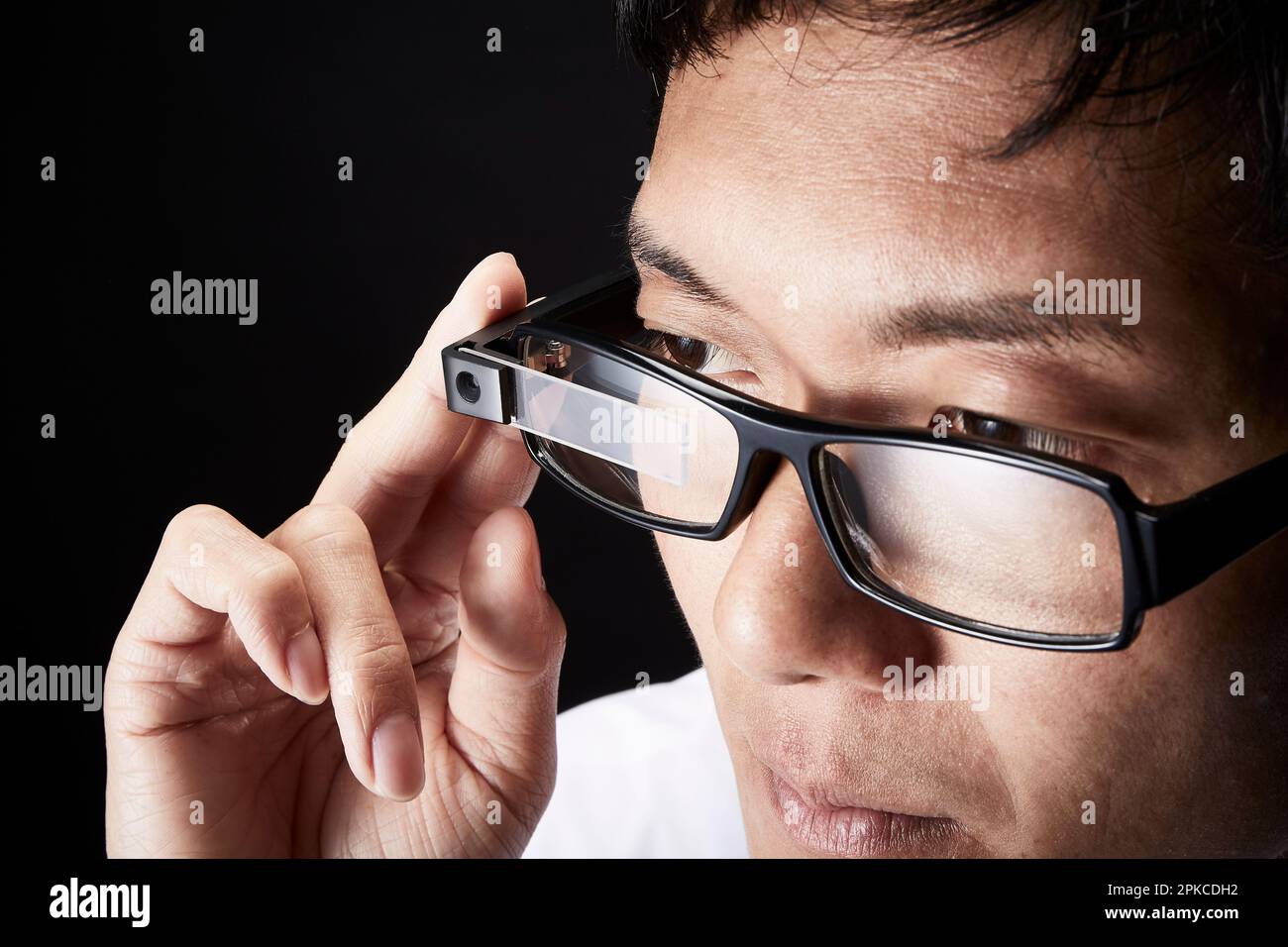 Man wearing smart glasses Stock Photo