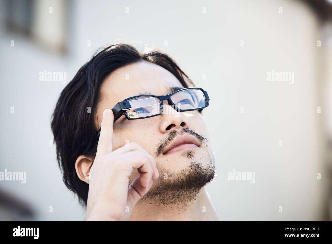 Man wearing Smart Glasses Stock Photo