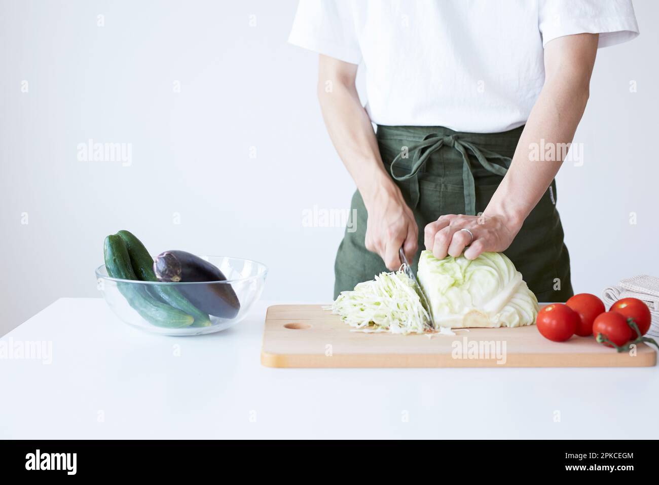 Man cutting cabbage into strips Stock Photo - Alamy