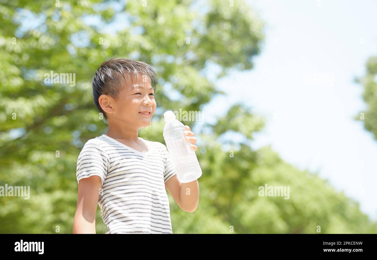 Teenage boy drinking water hi-res stock photography and images - Alamy