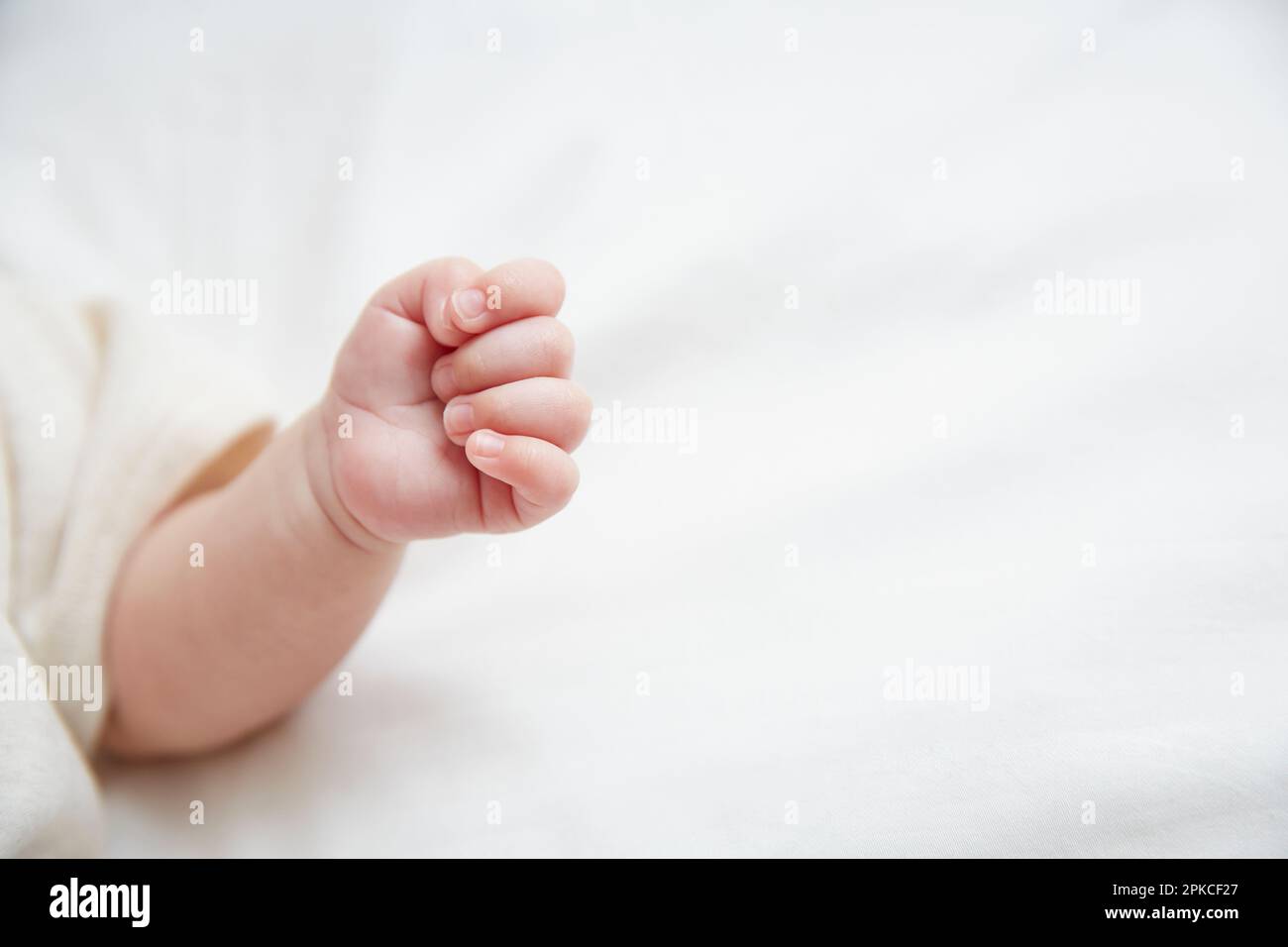 Baby sleeping on white sheets Stock Photo Alamy