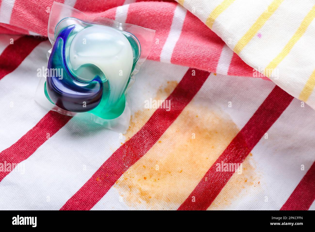 Laundry detergent on stained clothes, closeup Stock Photo Alamy