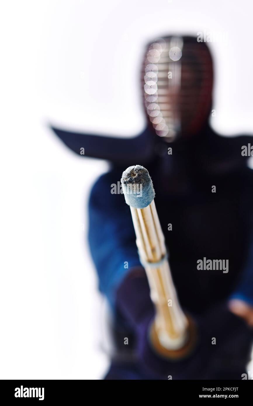 A man wearing a kendo uniform in kendo stance Stock Photo Alamy