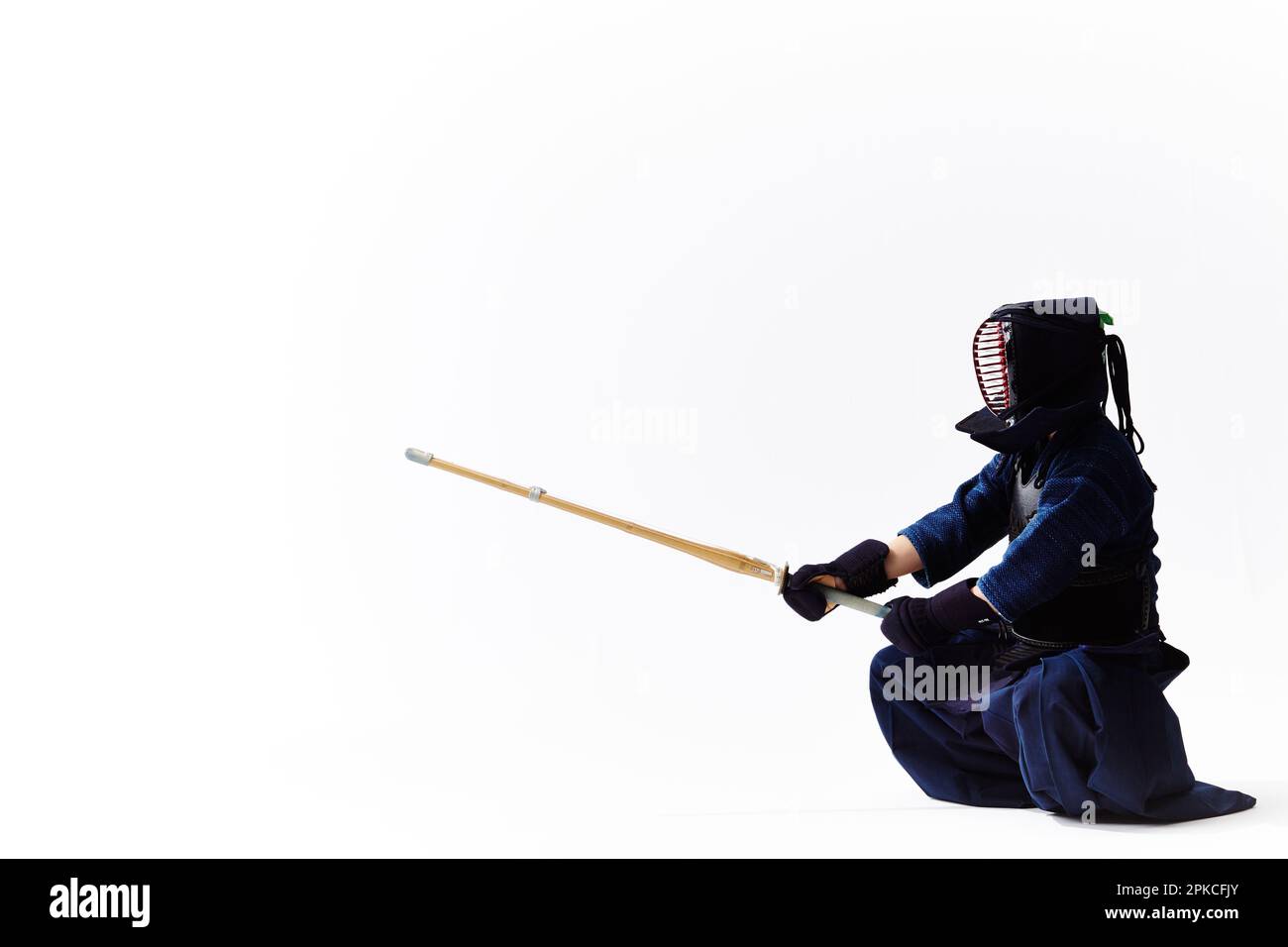 A man wearing a kendo outfit in kendo stance Stock Photo