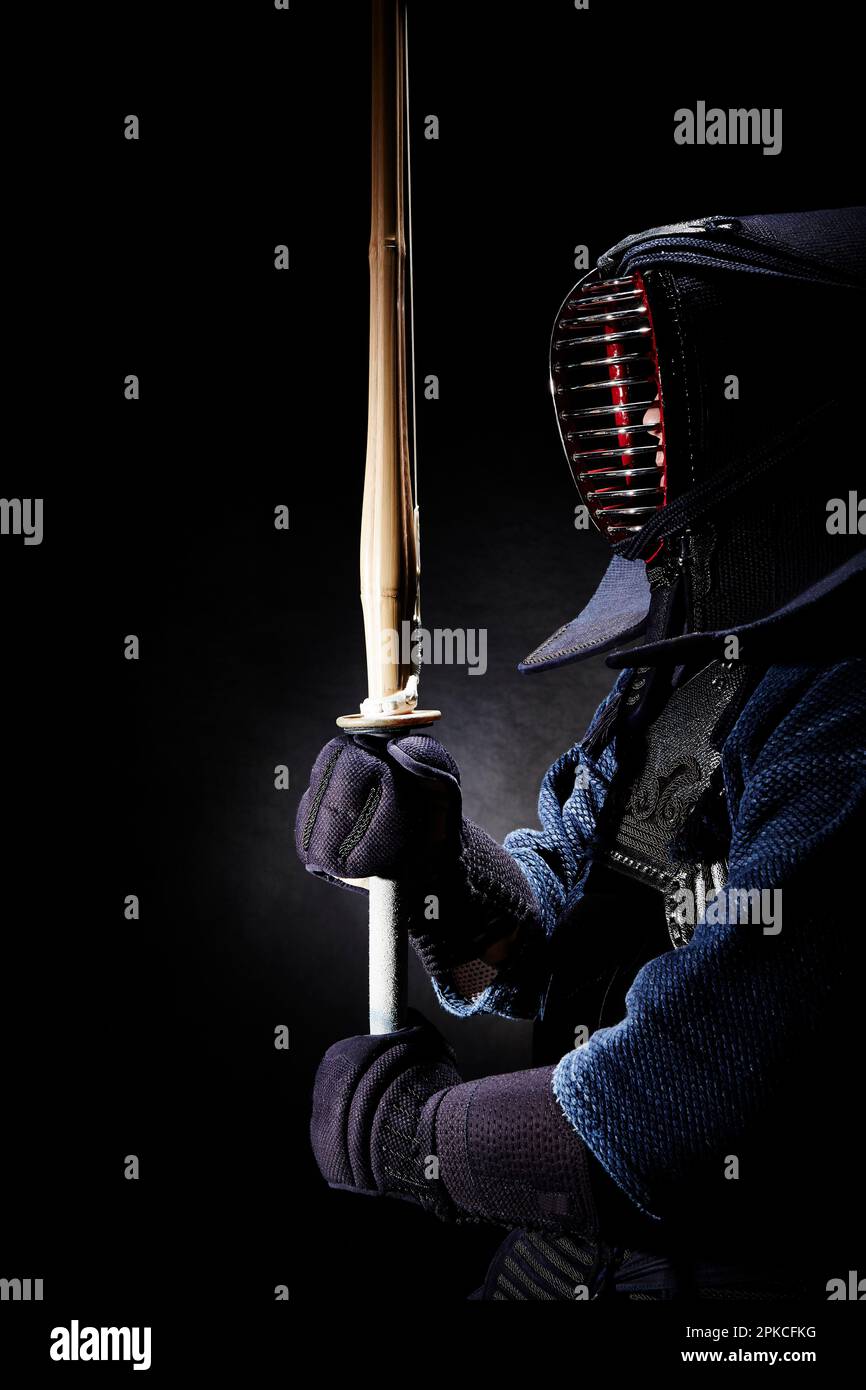 A man wearing a kendo kilt in kendo stance Stock Photo Alamy
