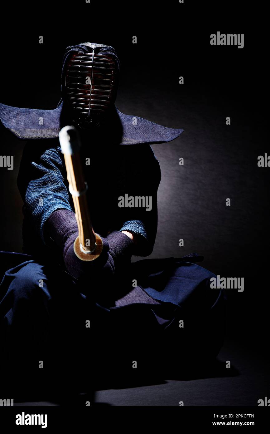 A man wearing a kendo gi in kendo stance Stock Photo Alamy