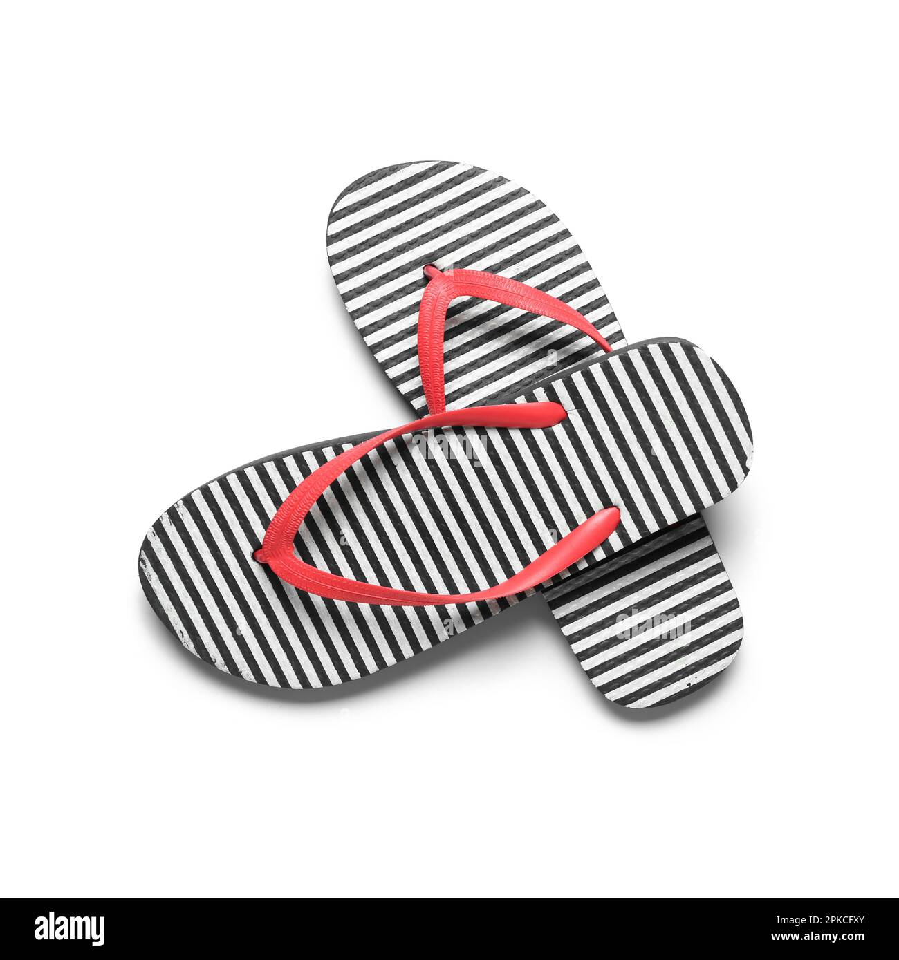 Pair of striped flip-flops on white background Stock Photo - Alamy