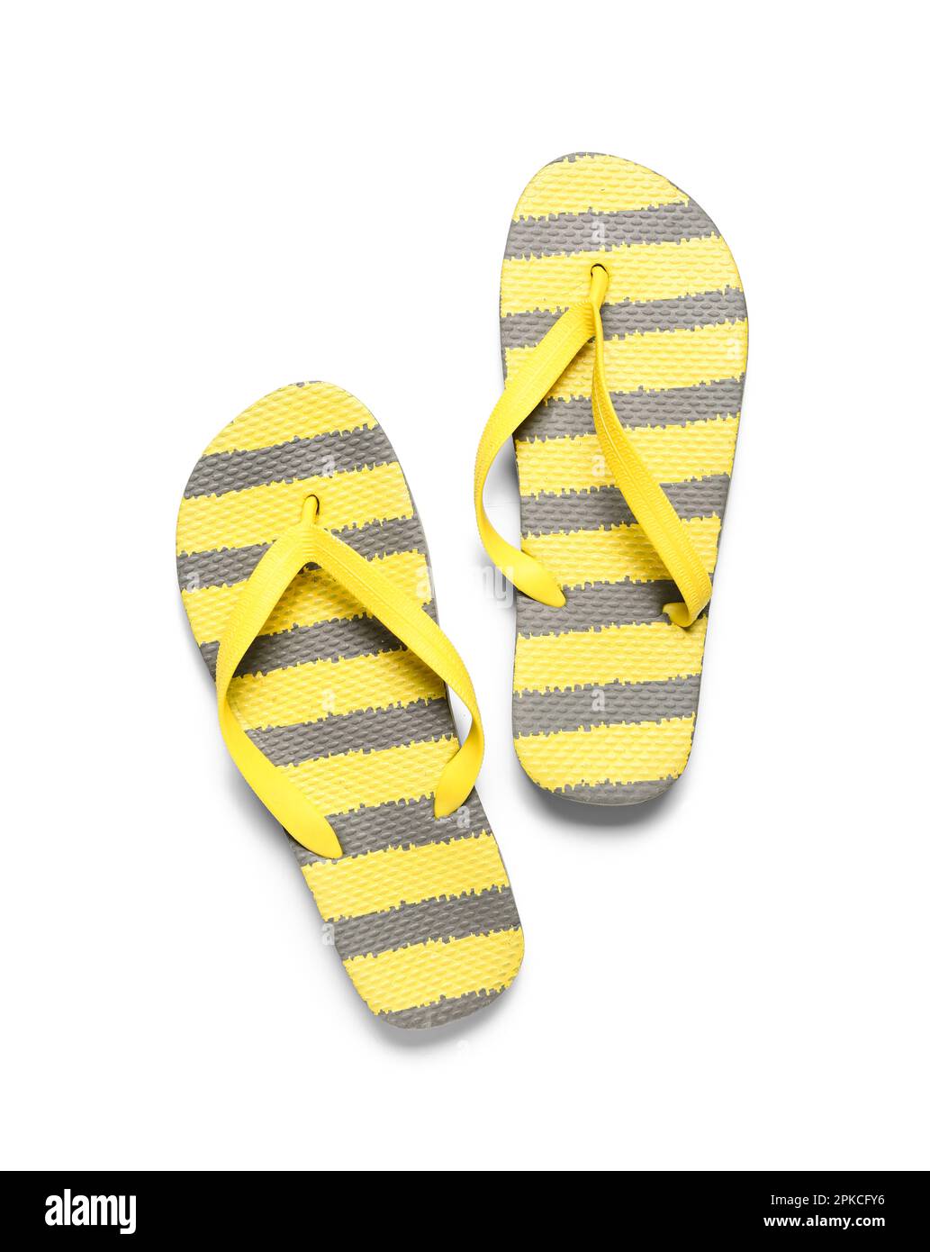 Pair of striped flip-flops on white background Stock Photo - Alamy