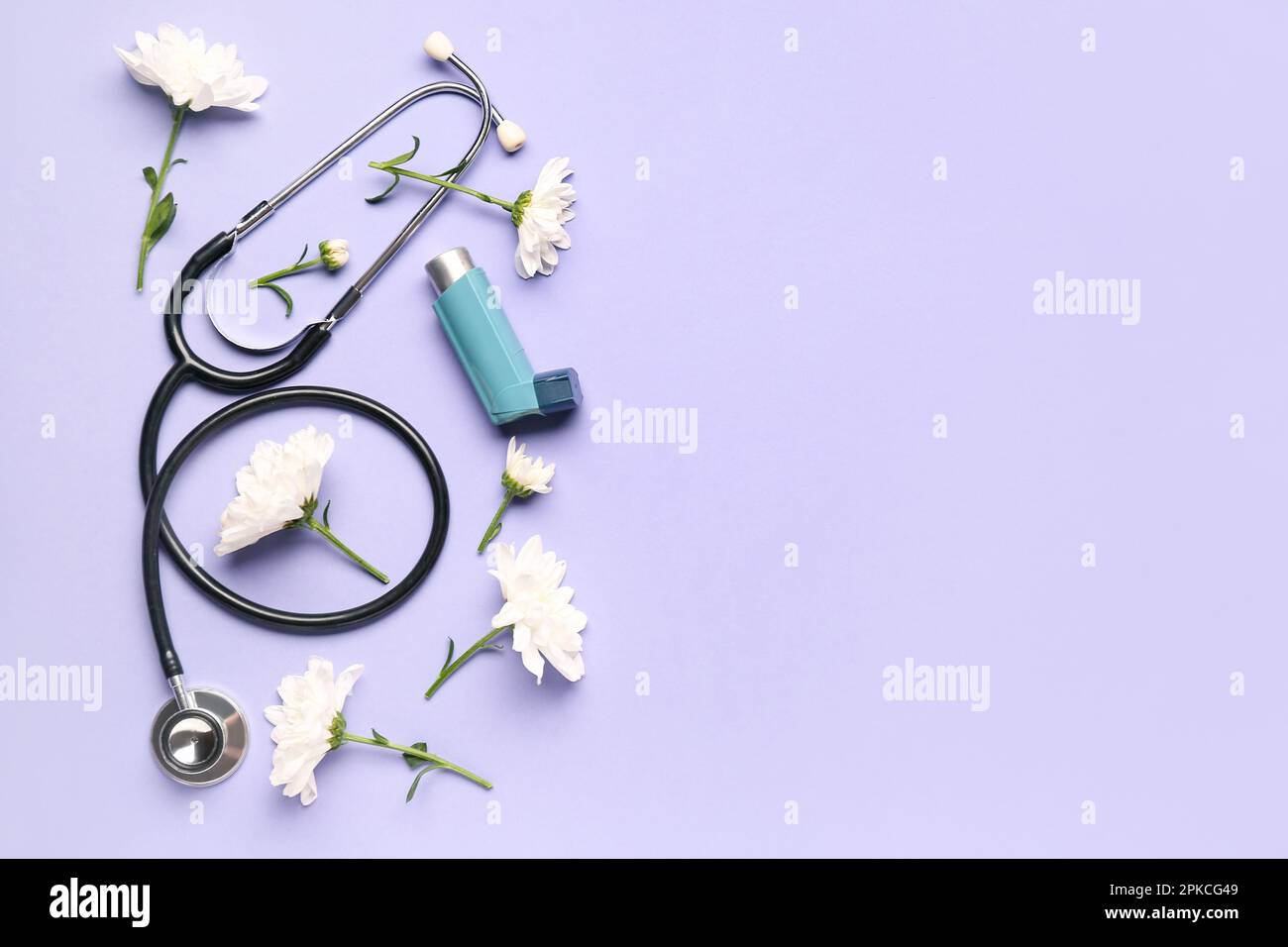 Asthma inhaler with flowers and stethoscope on lilac background Stock