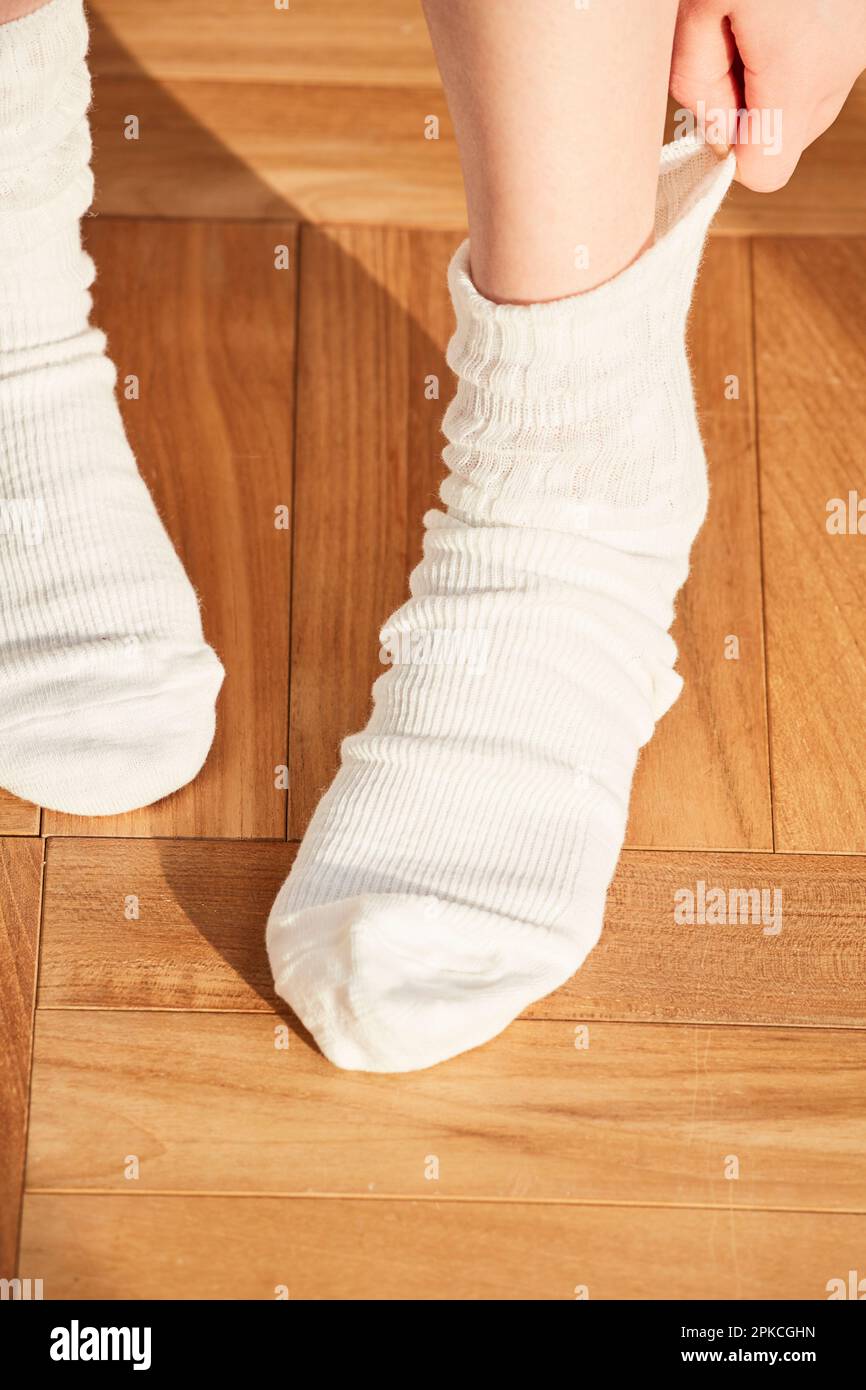 Woman's feet wearing white socks Stock Photo Alamy