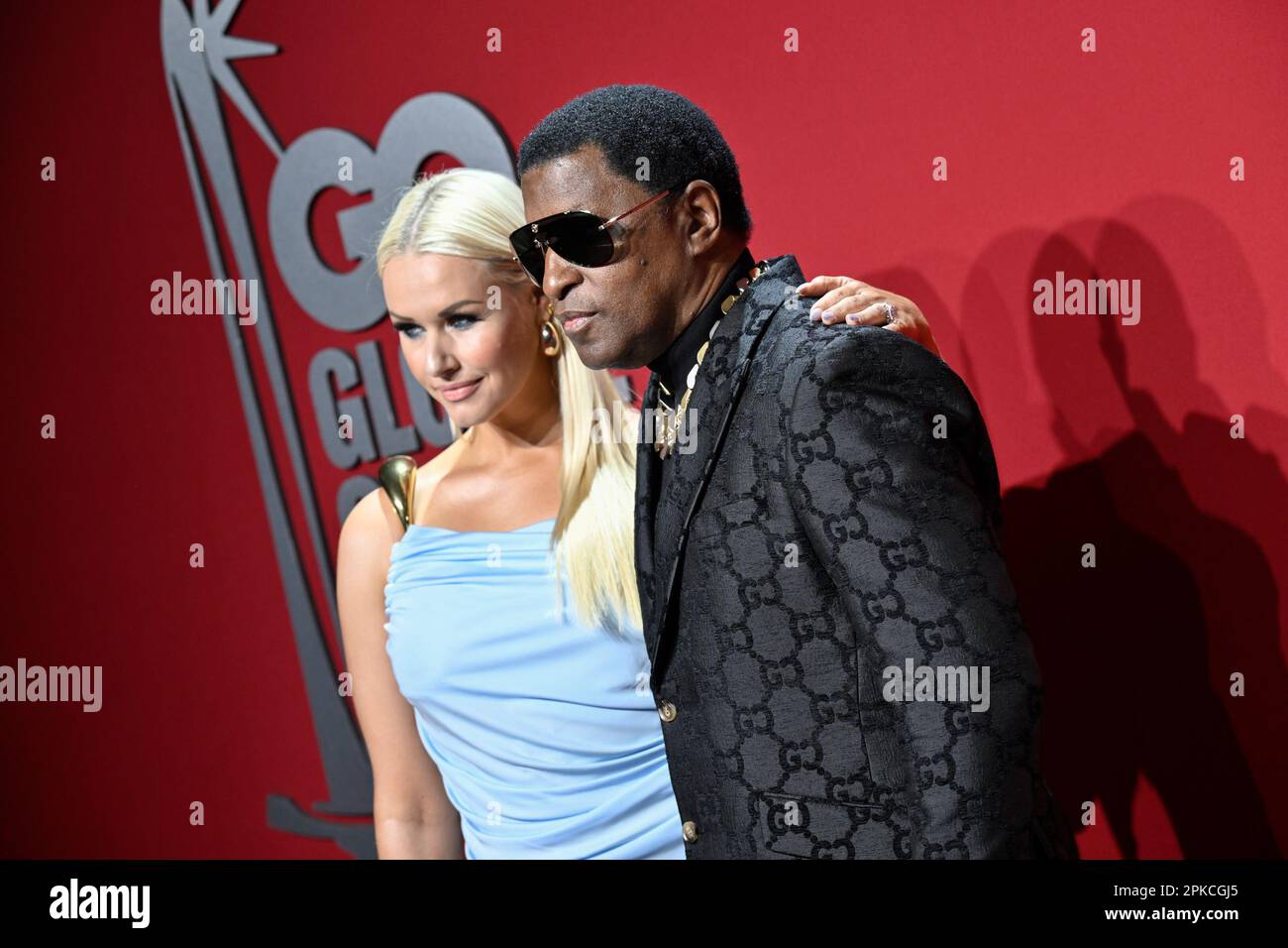 "Babyface" Edmonds, right, and girlfriend Rika attend the GQ