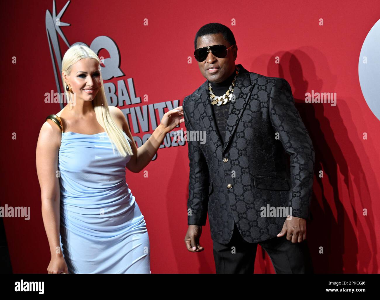 "Babyface" Edmonds, right, and girlfriend Rika attend the GQ