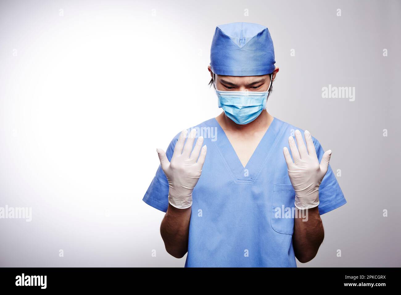 Male doctor wearing a surgical suit Stock Photo