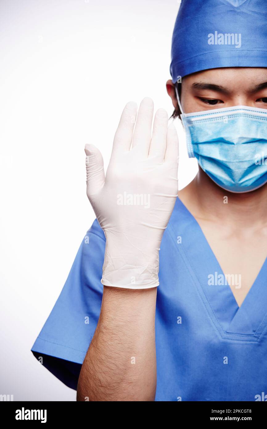 Male doctor wearing a surgical suit Stock Photo