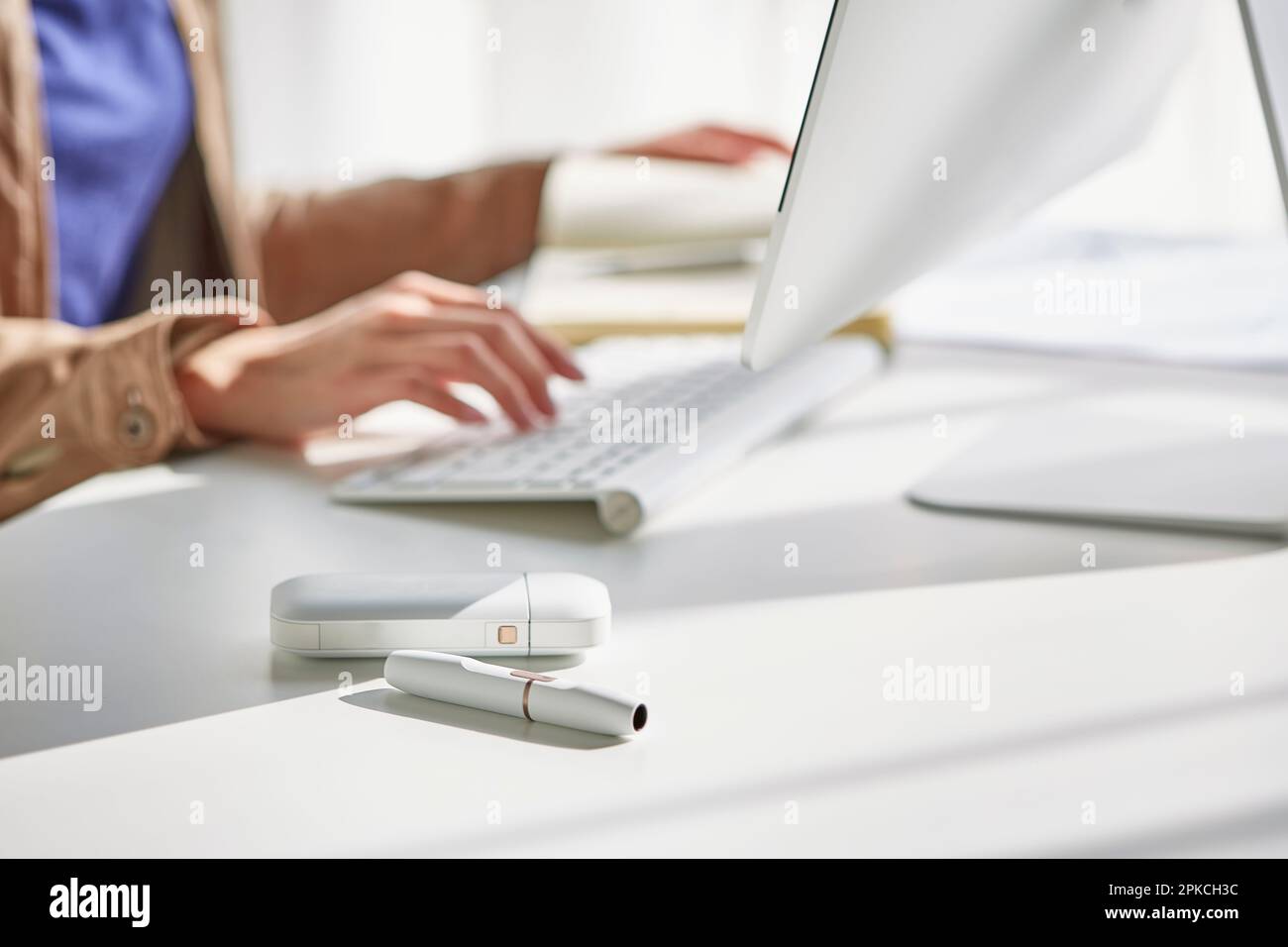 A woman working at her desk Stock Photo