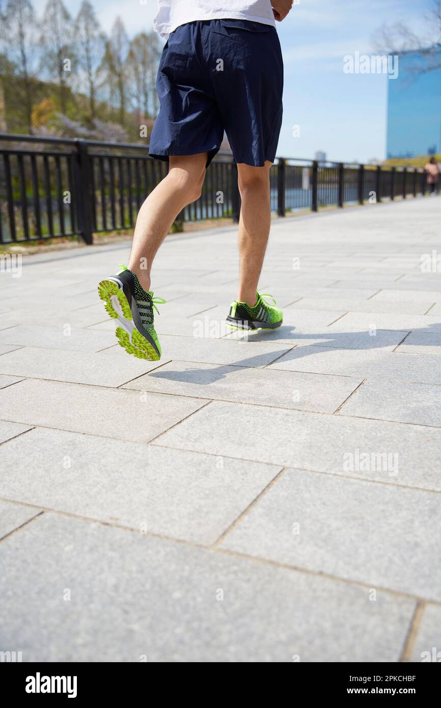 Lower body of a man jogging Stock Photo Alamy
