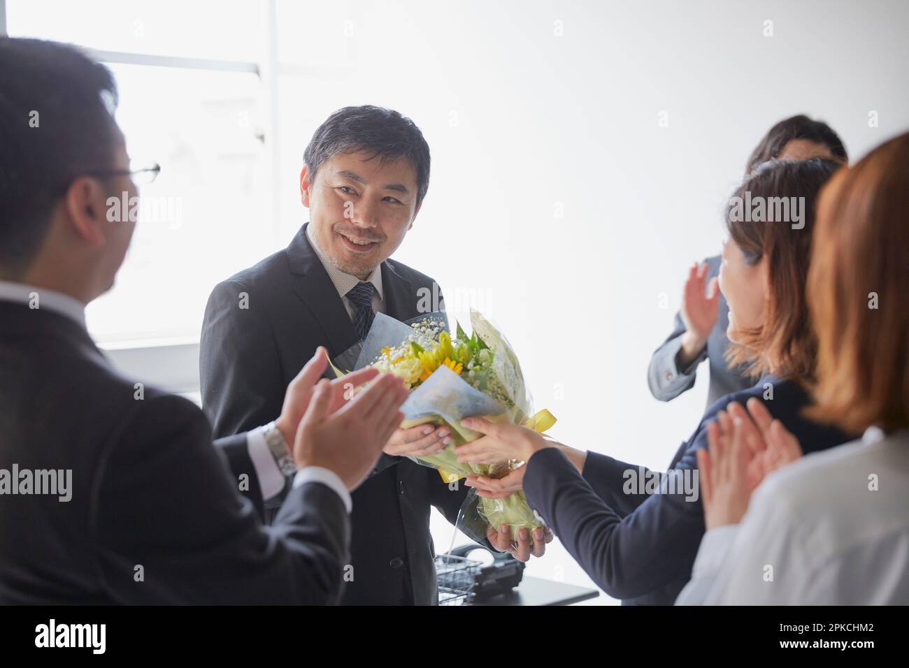 An employee sending a bouquet of flowers as a retirement gift and his