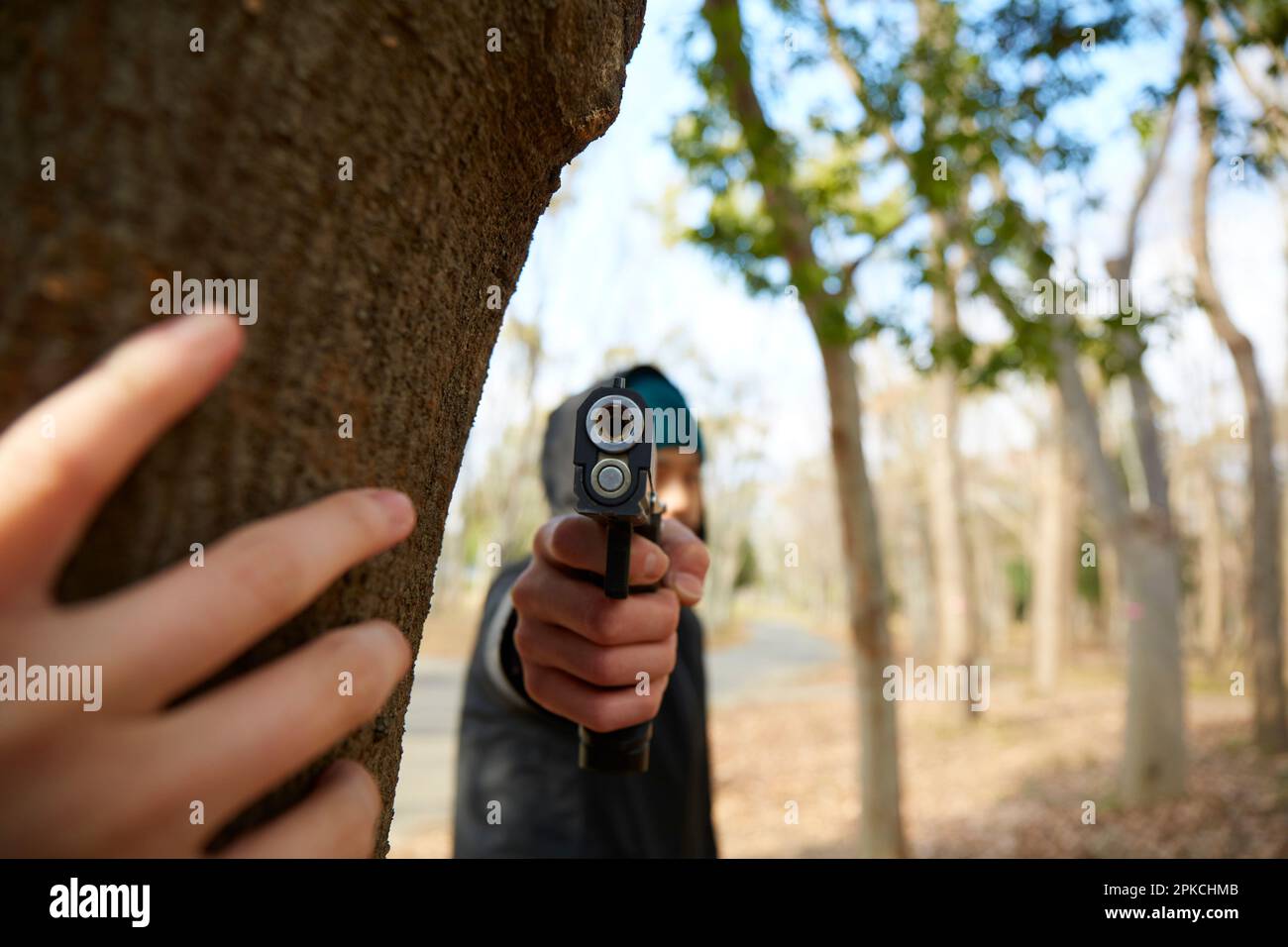 Man holding gun towards us Stock Photo Alamy