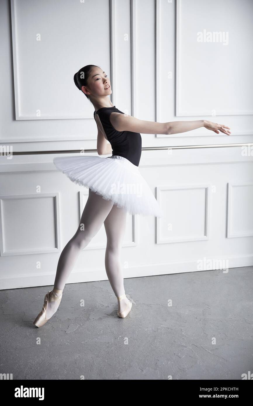 Ballerina posing with a bar Stock Photo