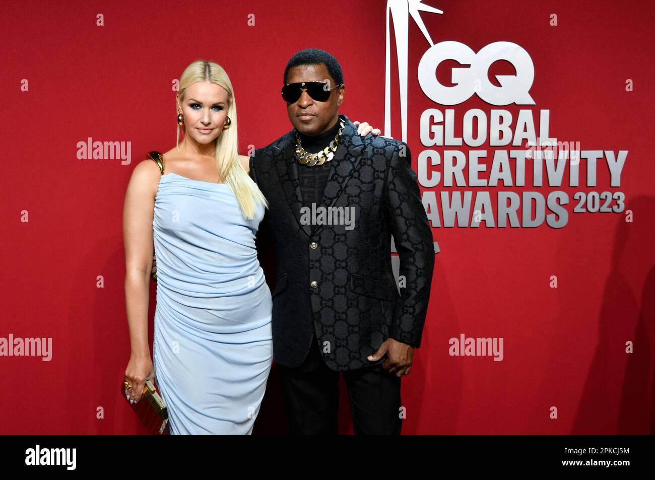 "Babyface" Edmonds, right, and girlfriend Rika attend the GQ