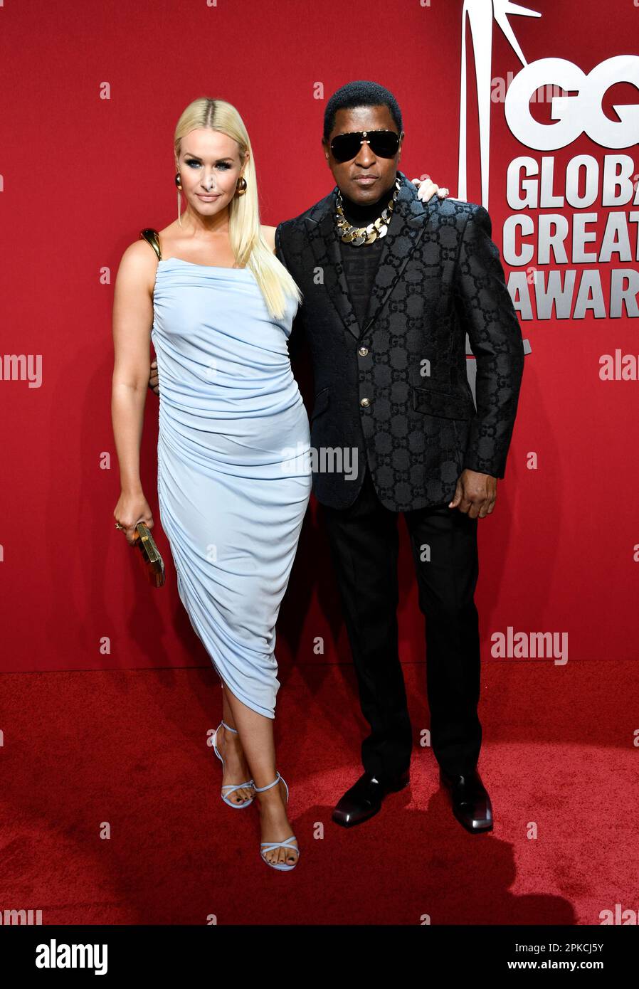 "Babyface" Edmonds, right, and girlfriend Rika attend the GQ