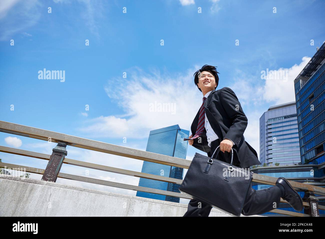 Businessman running in suit Stock Photo Alamy
