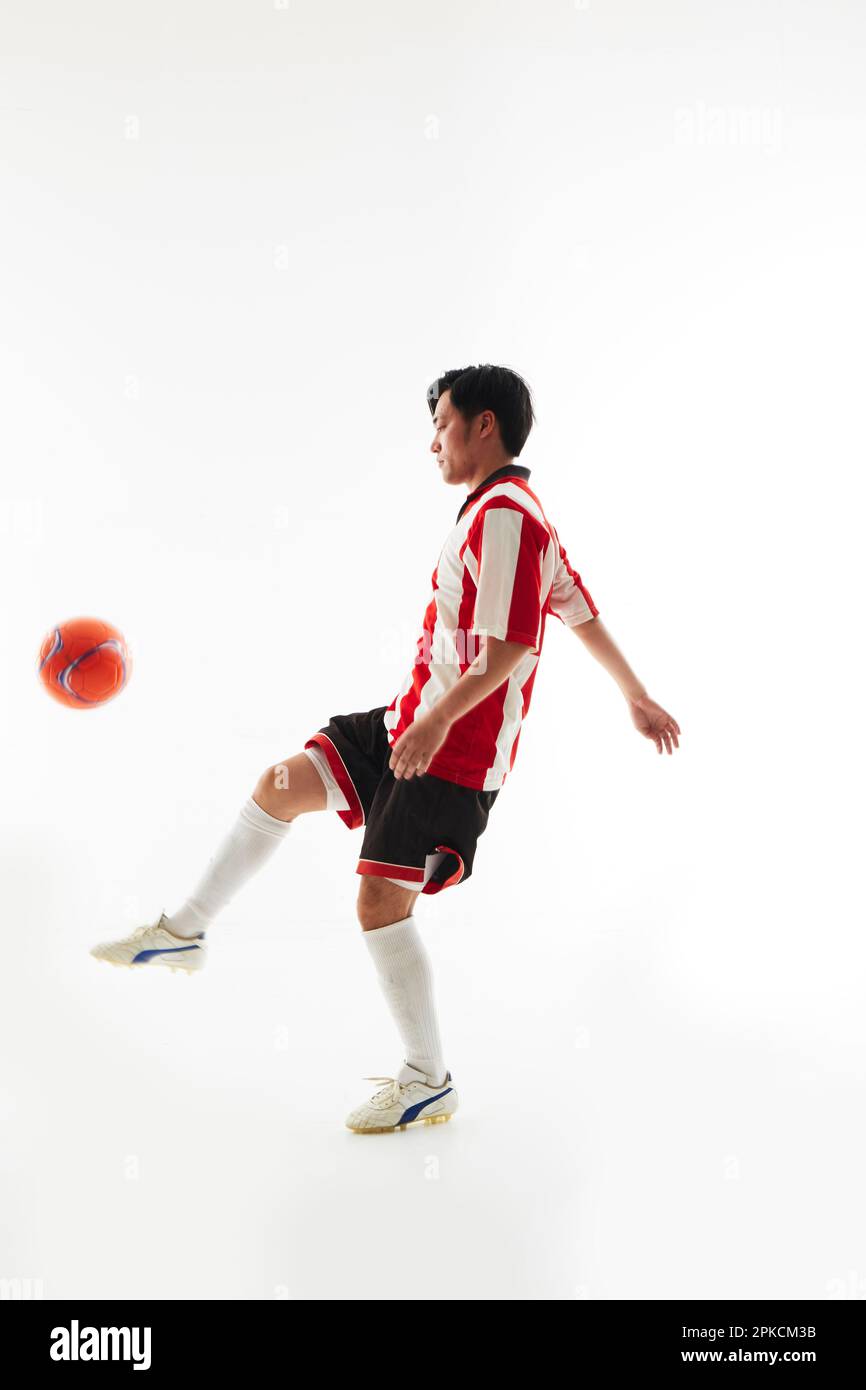 Soccer player lifting Stock Photo