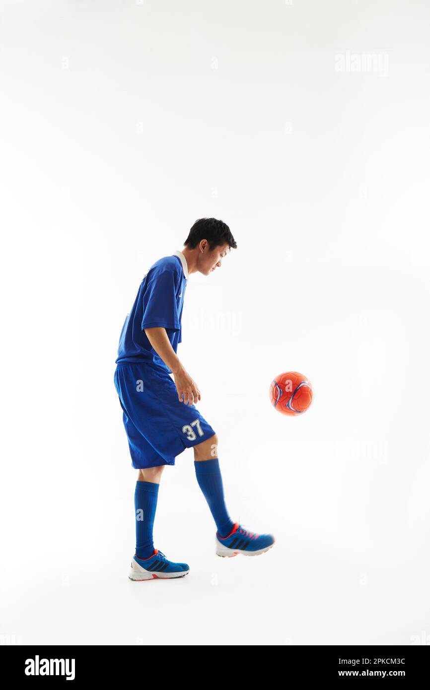 Soccer player lifting Stock Photo