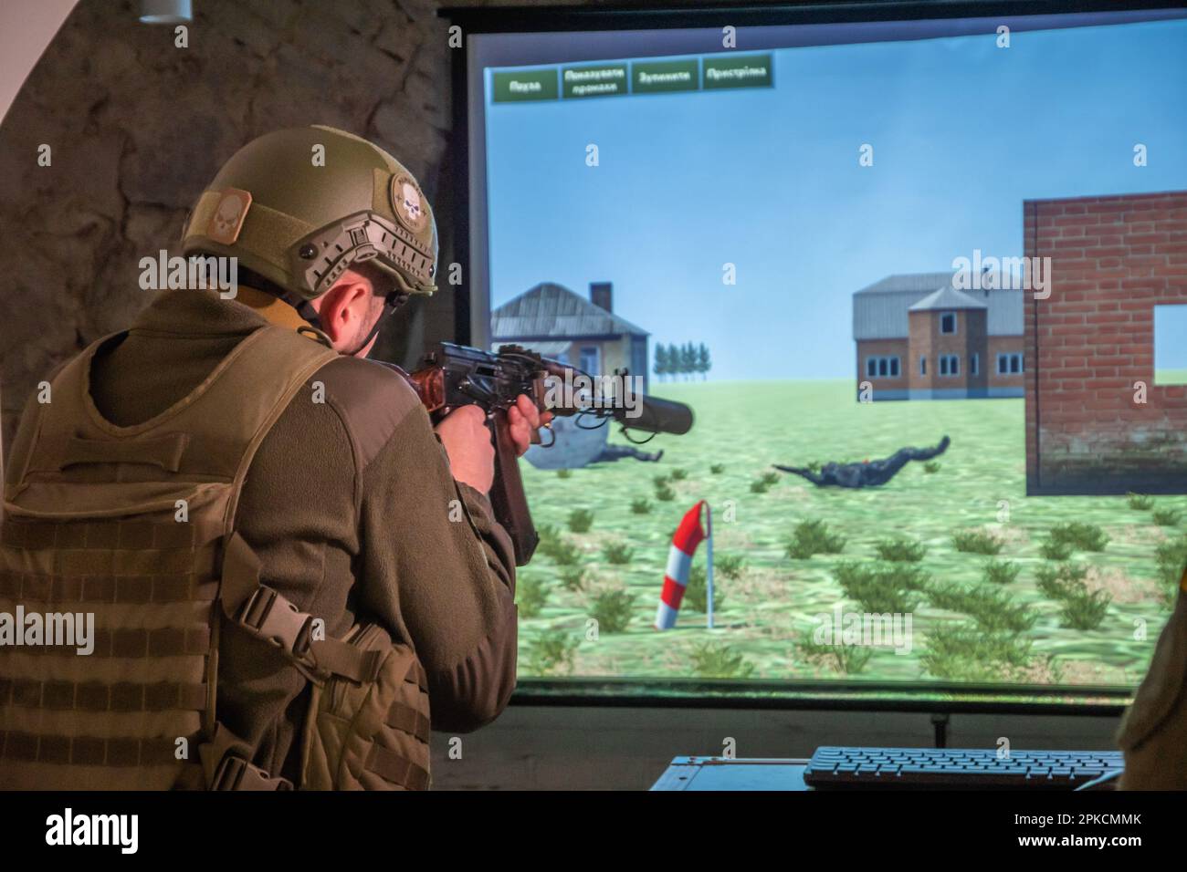 Lviv, Ukraine. 16th Feb, 2023. A military man in uniform holds a weapon in his hands and shoots at a target on a training screen Military personnel demonstrate the operation of an interactive shooting range - a fire training simulator, which the City Hall of Lviv purchased for the National Guard of Ukraine, in order to better prepare the military for combat operations at the front. A Fire Training Stimulator is an augmented or virtual reality training device for military personnel to train to conserve ammunition and master more weapons. (Credit Image: © Olena Znak/SOPA Images via ZUMA Press Stock Photo