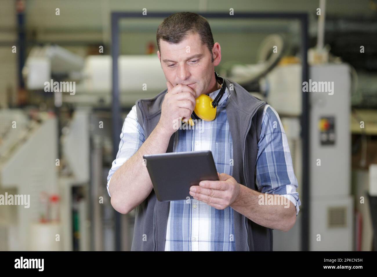 engineer uses laptop computers for machine maintenance Stock Photo Alamy